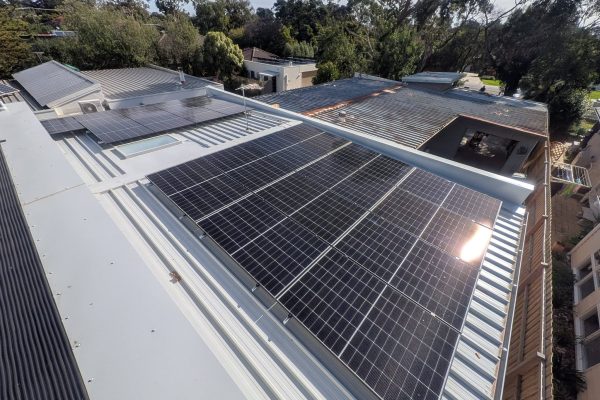 Solar panel installation on a metal roof by Quantum Electrical Services
